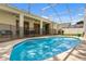 Outdoor pool area with screened-in enclosure and an outdoor dining table with chairs at 581 Hollingshead Loop, Davenport, FL 33896