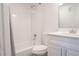 Bathroom featuring white vanity, subway tile and shower/tub combo at 6021 Village Cir # 6021, Orlando, FL 32822