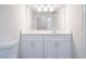 Updated bathroom featuring a modern vanity, new lighting and neutral colors at 6021 Village Cir # 6021, Orlando, FL 32822