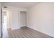 Bedroom with vinyl flooring and closet featuring a door with louvered slats at 6021 Village Cir # 6021, Orlando, FL 32822