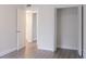 Bright bedroom featuring luxury vinyl flooring and a closet with louvered doors at 6021 Village Cir # 6021, Orlando, FL 32822
