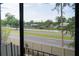 Enjoy peaceful views of the community from the unit's screened-in lanai at 6021 Village Cir # 6021, Orlando, FL 32822
