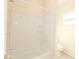Fresh bathroom featuring a bright white tiled shower and toilet at 611 Sanford Ave, Sanford, FL 32771