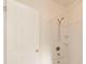 Bright bathroom featuring a shower-tub combo with white tiled walls at 611 Sanford Ave, Sanford, FL 32771