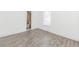 Bedroom showing gray tile floors and ensuite bathroom at 611 Sanford Ave, Sanford, FL 32771