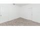Empty bedroom with tile floors and two white doors at 611 Sanford Ave, Sanford, FL 32771