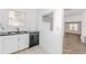 Kitchen featuring stainless steel appliances and a view into the living area at 611 Sanford Ave, Sanford, FL 32771