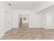 Large open-concept living room featuring wood floors, a view of kitchen, and bright natural light at 611 Sanford Ave, Sanford, FL 32771