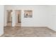 Open concept living room with kitchen view, new flooring and neutral paint at 611 Sanford Ave, Sanford, FL 32771