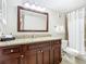 Bathroom featuring a sink and vanity with granite counters, a toilet and a shower with a curtain at 6403 Parc Corniche Dr # 4114, Orlando, FL 32821