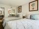 Bedroom with two queen beds, palm tree artwork and mirrored closet at 6403 Parc Corniche Dr # 4114, Orlando, FL 32821
