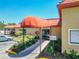 Inviting entrance with well-manicured landscaping and a covered awning at 6403 Parc Corniche Dr # 4114, Orlando, FL 32821