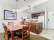 Kitchen area with granite counter tops and wooden cabinets next to dining room table at 6403 Parc Corniche Dr # 4114, Orlando, FL 32821