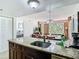 Well-appointed kitchen with granite counter and view into the sunny living space, ideal for entertaining at 6403 Parc Corniche Dr # 4114, Orlando, FL 32821