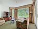 Cozy living room with large windows, curtains, and comfortable seating, creating a relaxing atmosphere at 6403 Parc Corniche Dr # 4114, Orlando, FL 32821