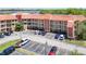 Exterior view of a multi-story condo building and parking lot at 6403 Parc Corniche Dr # 4114, Orlando, FL 32821