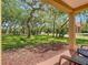 Relaxing covered patio featuring seating with beautiful landscaping views at 6403 Parc Corniche Dr # 4114, Orlando, FL 32821