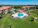 Community pool featuring a playful shape, surrounded by lush lawns and a playground for outdoor enjoyment at 6403 Parc Corniche Dr # 4114, Orlando, FL 32821