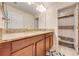 Bathroom with double sinks, granite countertops, and walk in shower at 6807 Habitat Dr, St Cloud, FL 34773