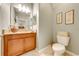 Bathroom with toilet, and granite topped vanity at 6807 Habitat Dr, St Cloud, FL 34773