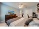 Cozy bedroom with large dresser, television, and closet at 6807 Habitat Dr, St Cloud, FL 34773