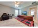 Bedroom featuring a bed, a desk, and a ceiling fan at 6807 Habitat Dr, St Cloud, FL 34773