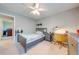 Bedroom with a ceiling fan, desk, and a closet at 6807 Habitat Dr, St Cloud, FL 34773