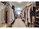 Spacious walk-in closet with ample shelving and plenty of hanging space for clothes and accessories at 6807 Habitat Dr, St Cloud, FL 34773