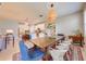 Open dining area with a wooden table and colorful rug, seamlessly connected to the kitchen at 6807 Habitat Dr, St Cloud, FL 34773