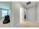 Light and airy hallway featuring neutral paint, neutral carpet, and access to multiple rooms at 6807 Habitat Dr, St Cloud, FL 34773