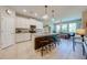 Bright kitchen featuring white cabinets, granite countertops, a large island and stainless steel appliances at 6807 Habitat Dr, St Cloud, FL 34773