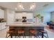 Stylish kitchen island with granite countertops, seating, and pendant lighting at 6807 Habitat Dr, St Cloud, FL 34773