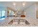 Close up on the kitchen sink and countertop, with a view of the Gathering room at 6807 Habitat Dr, St Cloud, FL 34773