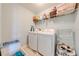 Functional laundry room with modern appliances and plenty of storage for supplies at 6807 Habitat Dr, St Cloud, FL 34773