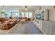 Spacious living room with a large sectional sofa, entertainment center, and ample natural light at 6807 Habitat Dr, St Cloud, FL 34773