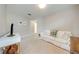Cozy living room featuring plush white seating, neutral paint, and access to adjacent spaces at 6807 Habitat Dr, St Cloud, FL 34773