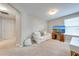 This room features a couch, TV, and an access door to a hallway at 6807 Habitat Dr, St Cloud, FL 34773