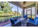 Enjoy outdoor living on this screened patio with cozy seating and relaxing views at 6807 Habitat Dr, St Cloud, FL 34773