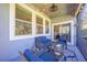 Relax on the patio with comfortable seating, string lights, and a view to the dining area at 6807 Habitat Dr, St Cloud, FL 34773