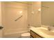 Bathroom featuring a tub, white tile, and a wooden vanity at 7167 Winding Lake Cir, Oviedo, FL 32765