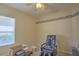 Cozy bedroom with massage chair, patterned wallpaper, and a window at 7167 Winding Lake Cir, Oviedo, FL 32765