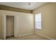 Bright bedroom with plush carpet, neutral paint, and closet storage at 7167 Winding Lake Cir, Oviedo, FL 32765