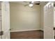 Cozy bedroom with wood flooring and a ceiling fan for added comfort at 7167 Winding Lake Cir, Oviedo, FL 32765