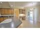 Bright breakfast nook with sliding glass doors, built-in desk, and wooden cabinets at 7167 Winding Lake Cir, Oviedo, FL 32765