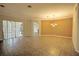 Bright and open living area with tile flooring, neutral walls, and sliding glass doors to the outdoors at 7167 Winding Lake Cir, Oviedo, FL 32765