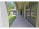 View of the home's outdoor patio with sliding glass doors at 7167 Winding Lake Cir, Oviedo, FL 32765