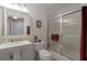 Clean and bright bathroom featuring a shower with sliding glass doors at 725 High Vista Dr, Davenport, FL 33837