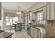 Charming eat-in kitchen area with a window overlooking the backyard at 725 High Vista Dr, Davenport, FL 33837