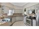 Well-equipped kitchen with stainless steel appliances and updated cabinetry at 725 High Vista Dr, Davenport, FL 33837