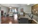 Open-plan living and dining area with hardwood floors and a comfortable seating arrangement at 725 High Vista Dr, Davenport, FL 33837